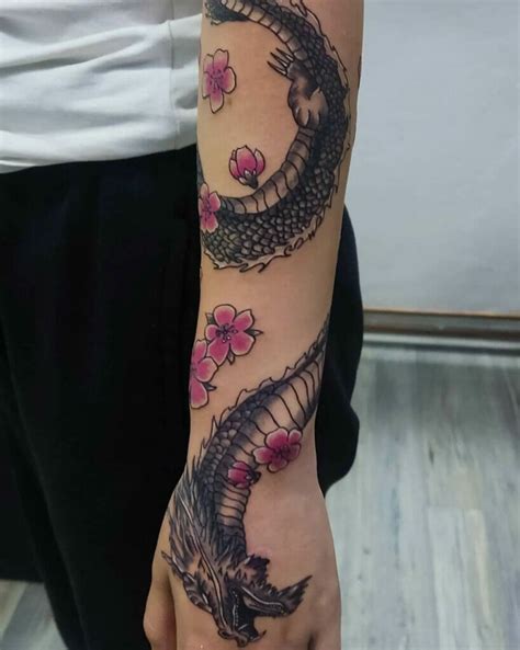 dragon wrapped around arm tattoo